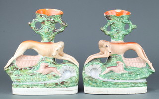 A pair of Staffordshire spill vases of greyhounds and hares 12" 