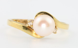 An 18ct yellow gold cultured pearl and diamond ring size L 1/2
