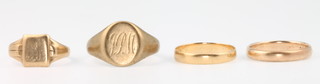 A 14ct yellow gold ring 1.5 grams size N, an 18ct gold band 1 gram size O, a 9ct yellow gold signet ring 5 grams size T and a 9ct yellow gold signet ring 1.5grams size N 