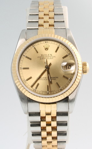 A lady's bi-metallic Rolex Oyster Perpetual datejust calendar wristwatch no. L510128 68273, contained in a box with some paperwork  