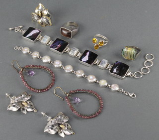 A pearl set 925 bracelet, 2 pairs of earrings and 4 rings