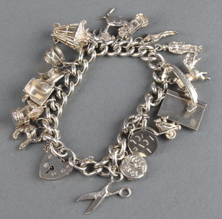 A silver charm bracelet 75 grams