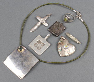 A silver cross pendant, 2 others, a ring, charm, stamp envelope and necklace 76 grams 