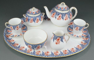 A Royal Worcester Bachelor's teaset comprising teapot, 2 tea cups and saucers, sugar bowl with lid, slop bowl, cream jug and oval tray 