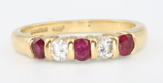 An 18ct yellow gold diamond gem set ring, size I 1/2, 3.2 grams
