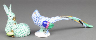 A Herend figure of a peacock 9", a ditto of 2 rabbits 4" 