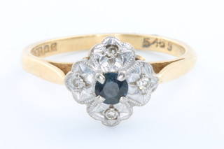 An 18ct yellow gold sapphire and diamond cluster ring, size L 1/2