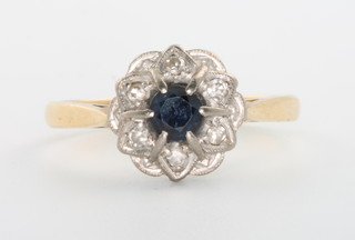 An 18ct yellow gold sapphire and diamond cluster ring, size O 1/2