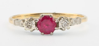 An 18ct yellow gold ruby and diamond ring, size Q