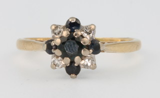 An 18ct yellow gold sapphire and diamond cluster ring size L 