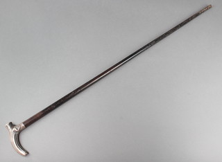 An Edwardian ebonised walking cane with silver grip London 1903 