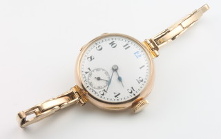 A ladys 9ct yellow gold wrist watch on a ditto bracelet