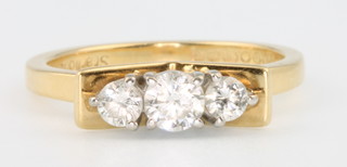 An 18ct yellow gold 3 stone diamond ring size N