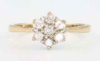 A 9ct yellow gold diamond cluster ring size N