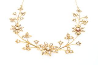 An Edwardian 15ct yellow gold seed pearl set floral necklace
