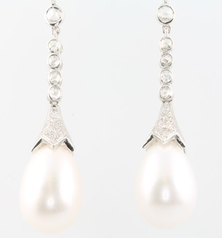 A pair of 18ct white gold cultured pearl and diamond ear drops, the diamonds approx. 0.58ct 