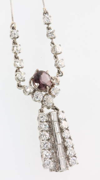 A white gold pink sapphire and diamond Art Deco style drop pendant, the brilliant cut pink sapphire 2.2ct surround by brilliant and baguette cut diamonds 2.2ct 