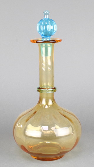 A 1930's French amber coloured glass baluster decanter with blue stopper 13 1/2" 