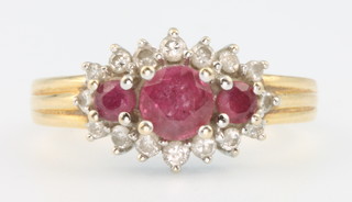 An 18ct yellow gold ruby and diamond ring, size M 1/2