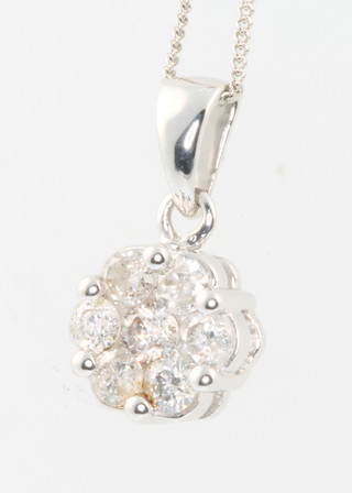 A 9ct white gold diamond set pendant and chain 