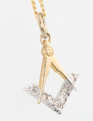 A diamond set Masonic pendant on a 9ct yellow gold chain