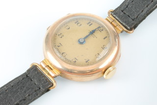 A lady's 9ct yellow gold Benson wristwatch on a leather strap 