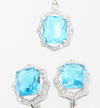 A silver, cubic zirconia and blue stone set necklace and earrings 