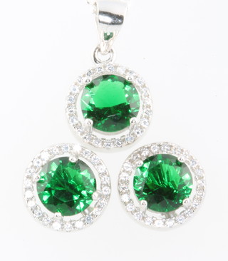 A silver green stone and cubic zirconia pendant and earrings 