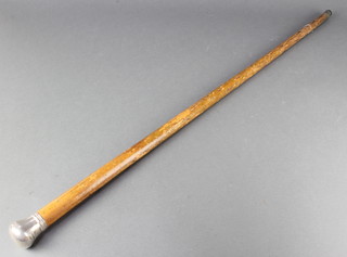 A silver topped walking cane