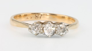 An 18ct yellow gold 3 stone diamond ring size K 1/2