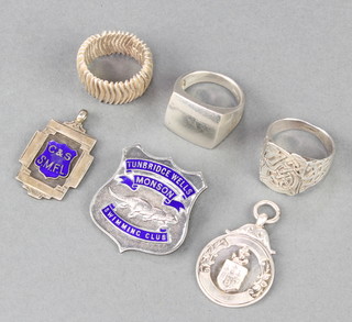 2 silver sports fobs, a badge and 3 rings 56 grams