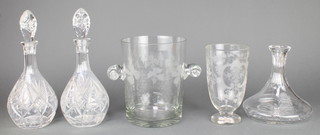 A cut glass wine cooler with vinous decoration 9", a vase, a pair of decanters and 1 ships decanter 