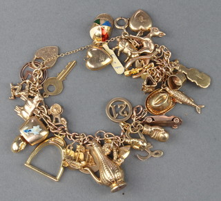 A 9ct yellow gold charm bracelet and a quantity of loose charms approx. 47 grams 