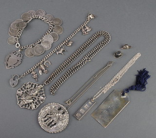 A silver ingot pendant, 2 charm bracelet and minor silver jewellery 
