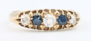 An 18ct yellow gold sapphire and diamond ring, size N