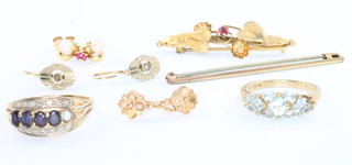 An Edwardian 9ct garnet bar brooch, a 9ct ditto and minor gold earrings and a gem set ring 