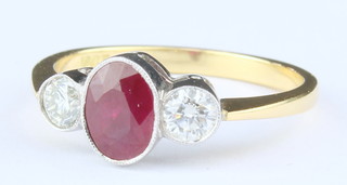 An 18ct yellow gold oval ruby 0.95 ct and 2 stone diamond 0.40 ct ring