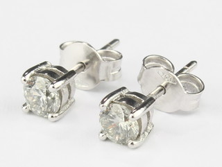 A pair of 18ct white gold single stone diamond 0.65ct ear studs