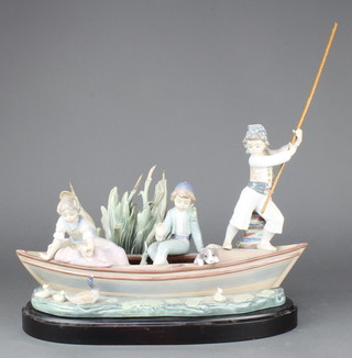 A Lladro group of 3 children in a boat with a puppy 1731 17" 