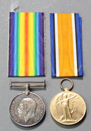A World War One pair of medals to 55689 Pte.C.W.Mitchell Manch.R. in original posting box