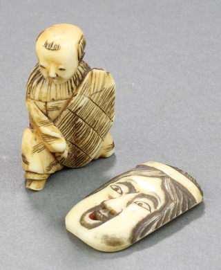 A Japanese Netsuke in the form of an Oni mask, an Okimono of a man 1 1/2" 