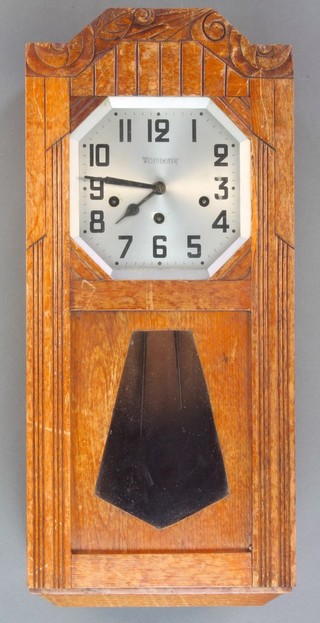 An Art Deco 8 day chiming wall clock with 8" octagonal silvered dial contained in an oak case  