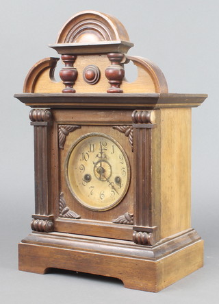 A 19th Century Continental 8 day striking bracket clock with paper dial and Arabic numerals contained in a walnut case (wormed)  