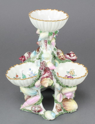 A Samson Plymouth porcelain shell table salt, the centre bowl above 3 further scallop shell moulded bowls decorated with flower sprays within shell encrusted borders 9"h 