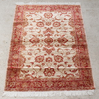 A gold coloured Belgian cotton Ziegler rug with floral design 73" x 52 1/2" 