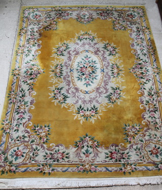 A yellow ground and floral patterned Chinese carpet 147" x 109" 