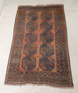 An Afghan rug with 10 octagons to the centre 93 1/2" x 58" 