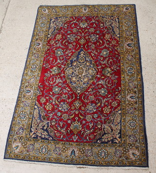 A Persian red and blue ground Qum rug 80" x 52" 