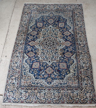 A white and blue ground Persian Nain carpet with central medallion 123" x 77" 