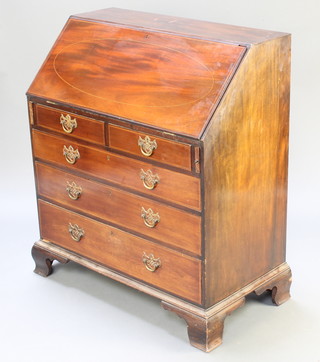 A 19th Century mahogany bureau, the fall front revealing a well fitted interior with pigeon holes and drawers above 2 short and 3 long drawers with brass drop handles, raised on bracket feet 38 1/2"h x 33"w x 18"d 